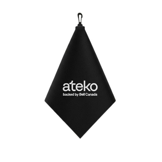 Black towel with 'ateko' logo on a white background